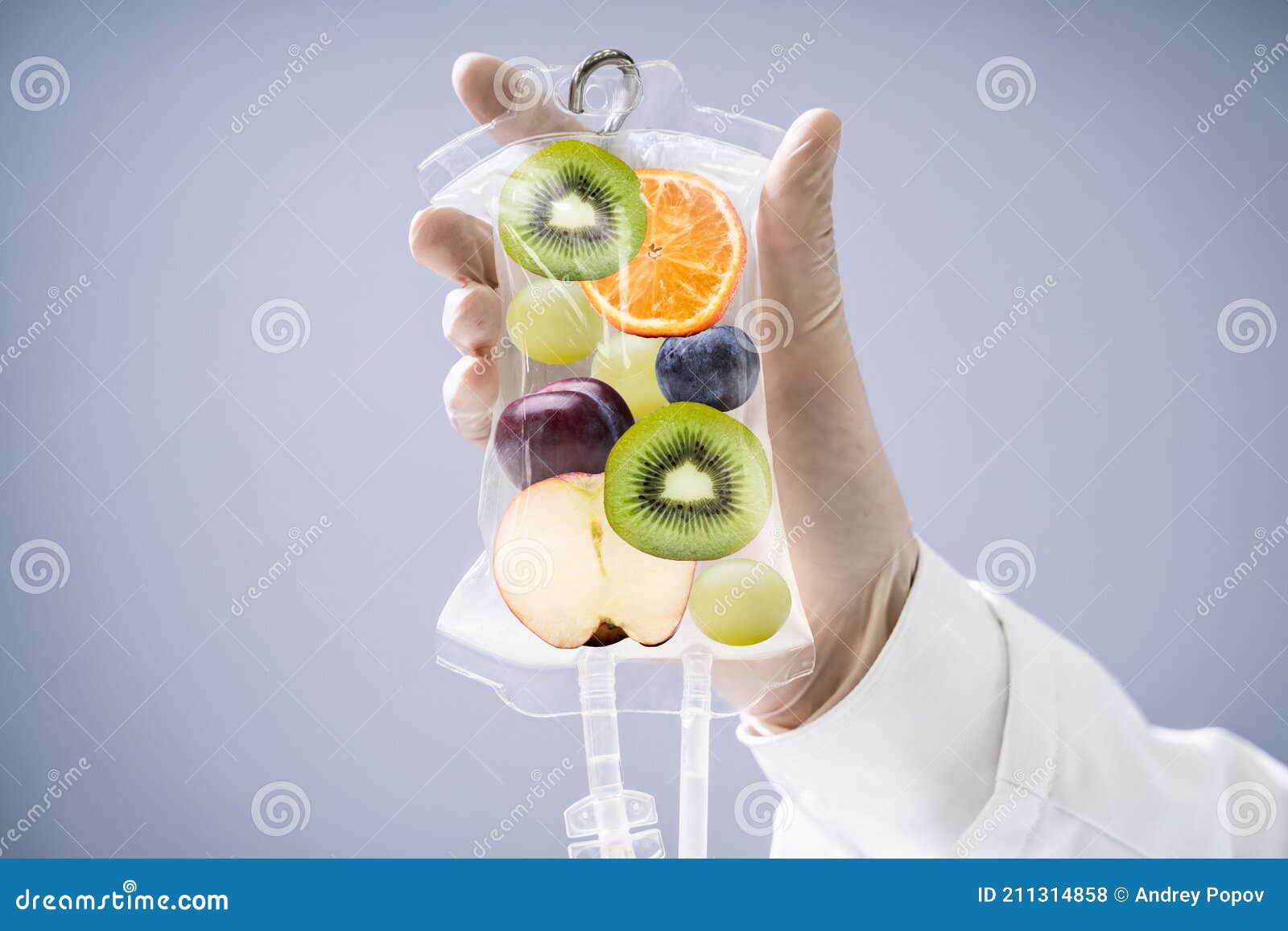 doctor holding saline bag with fruit slices inside in hospital