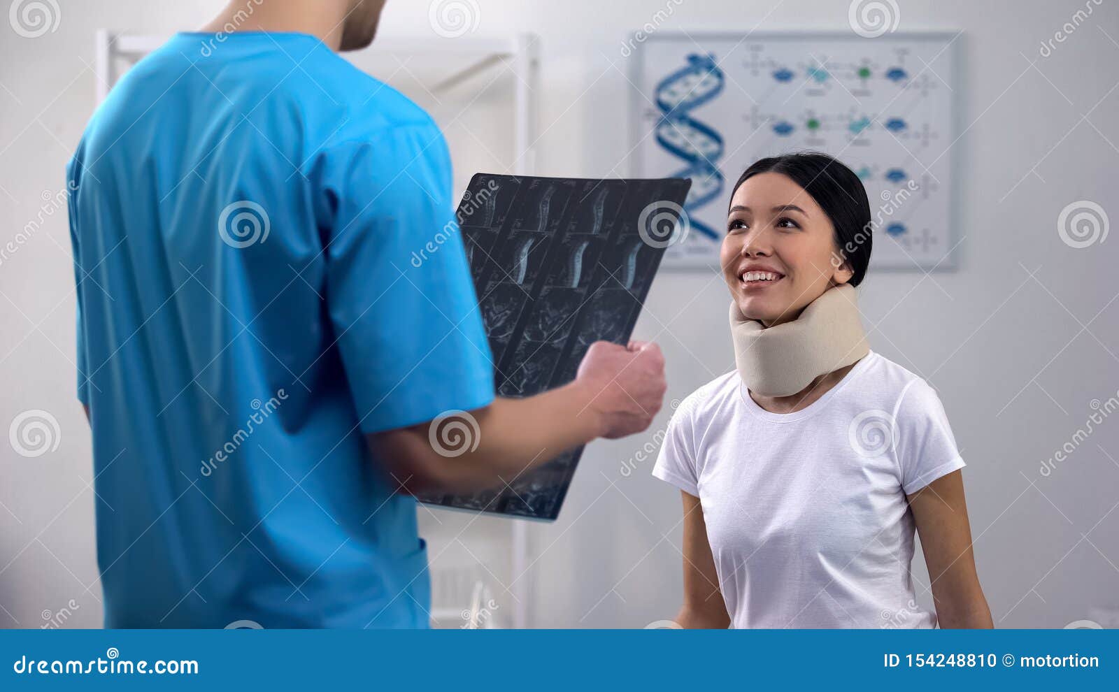 male doctor informing female patient in foam cervical collar good x-ray result