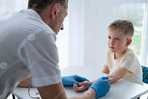A Male Doctor Makes An Important Mantoux Test On A Child The Doctor A Male Doctor Makes An Important Mantoux Test On A Child The Doctor