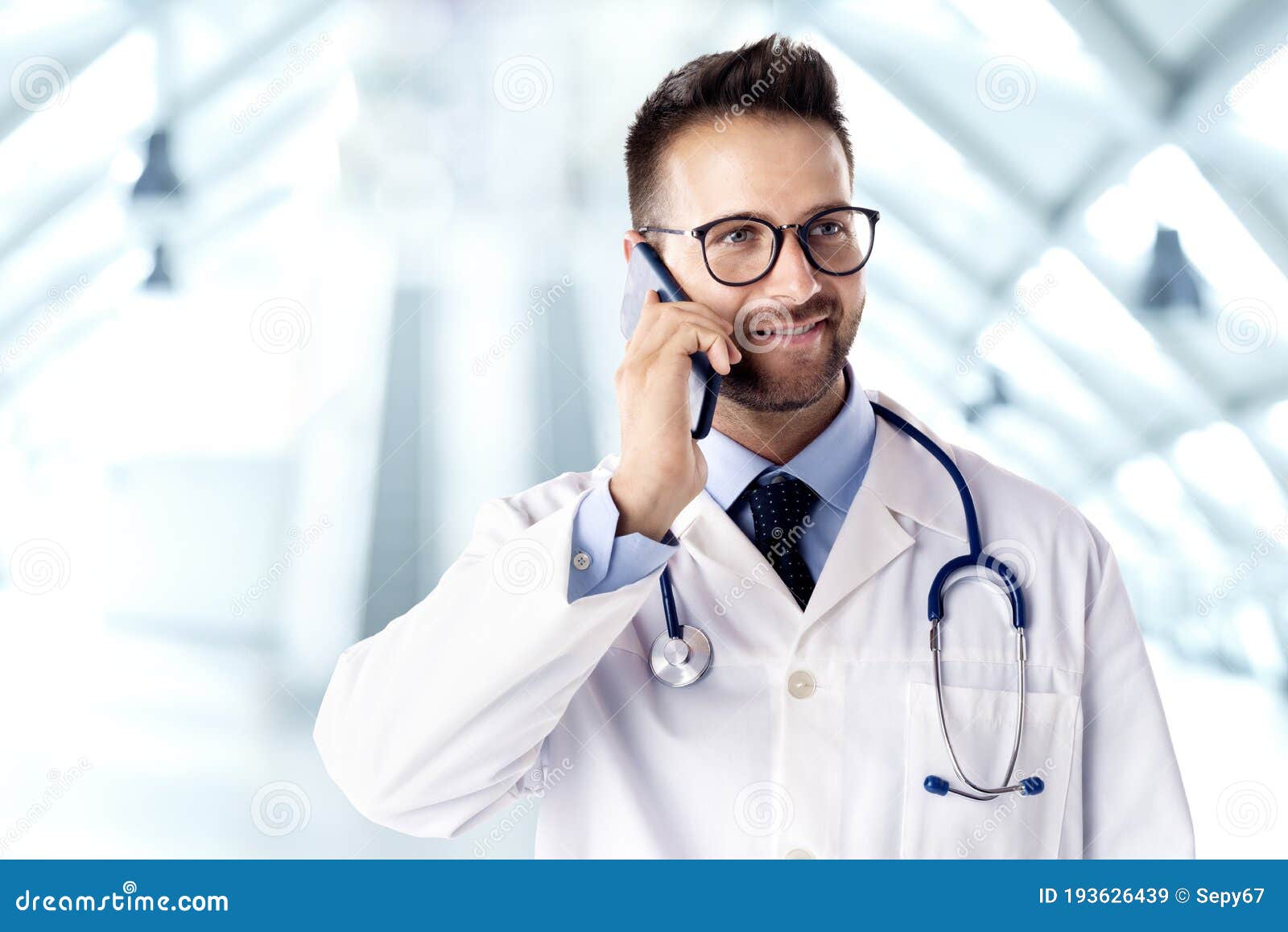 male doctor talking on cell phone with his patient