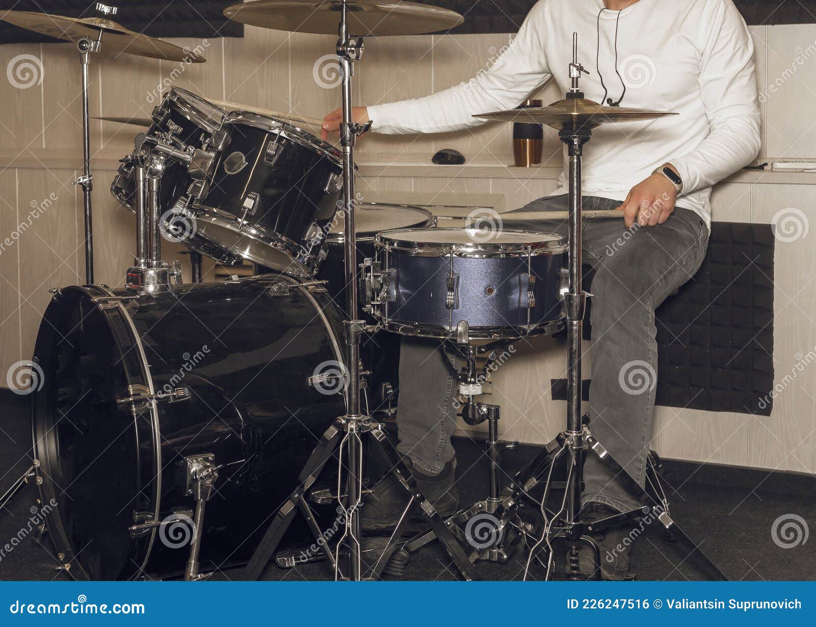 Male Drum Player Hands Holding Cymbals with Both Hands and Sticks