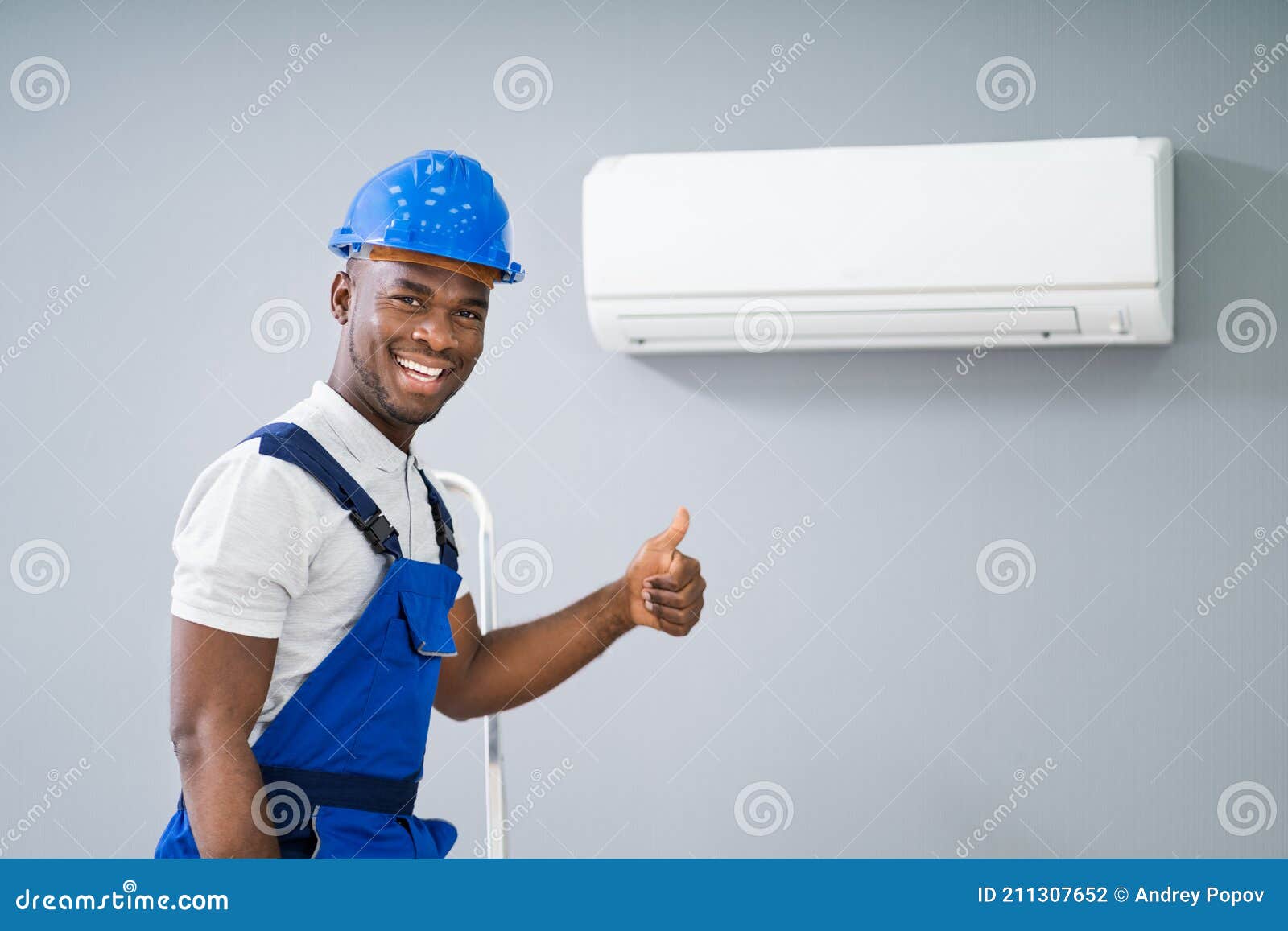 male electrician gesturing thumbs up