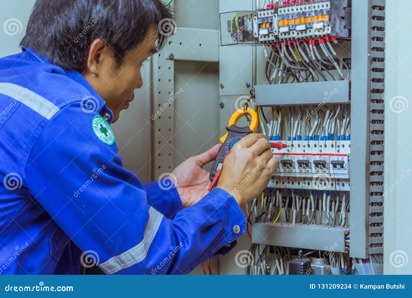 Male Engineers are Checking the Electrical System with Electronic Tools