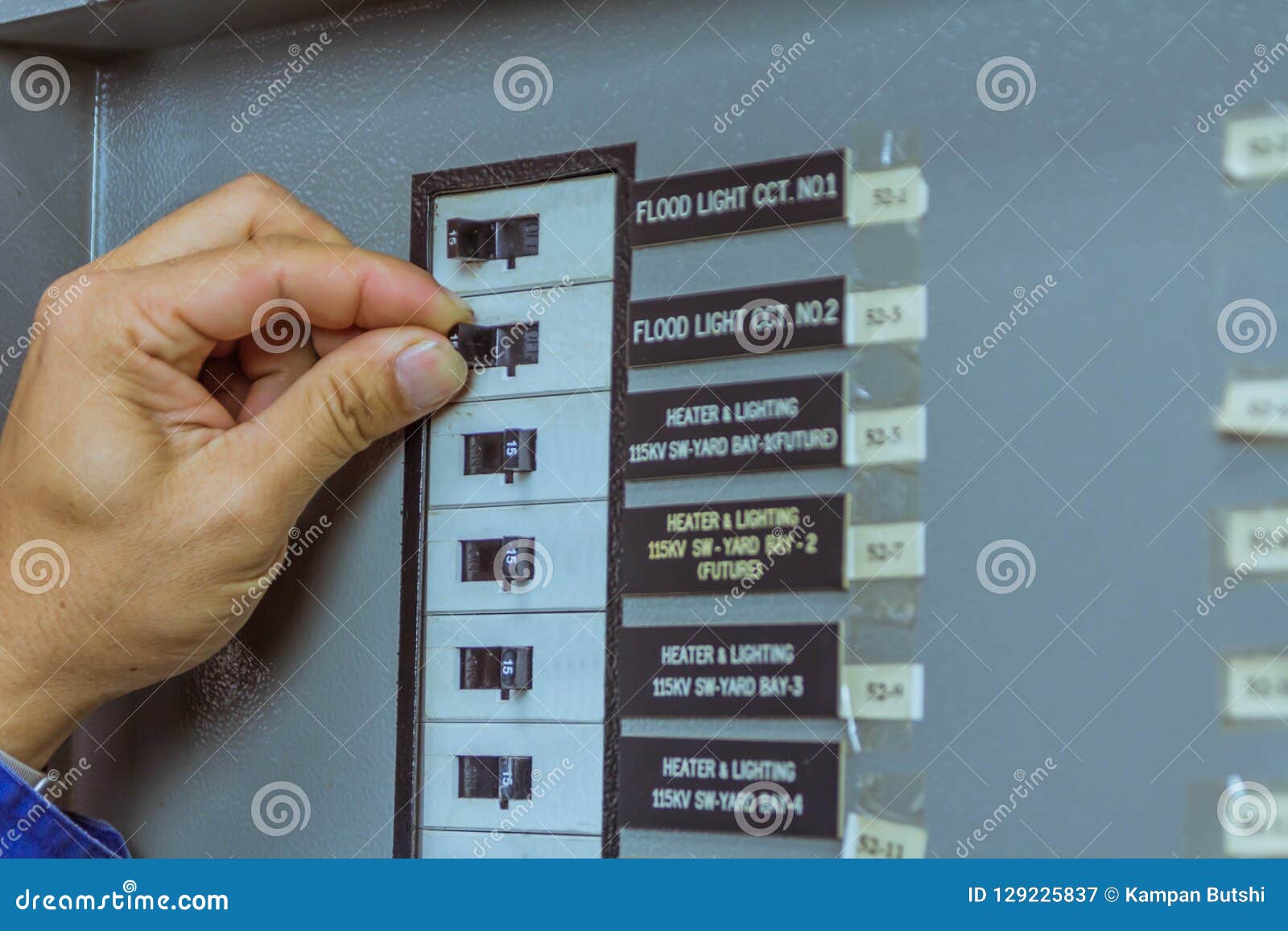 Male Engineers are Turn Off Breaker for Check Electrical System Stock