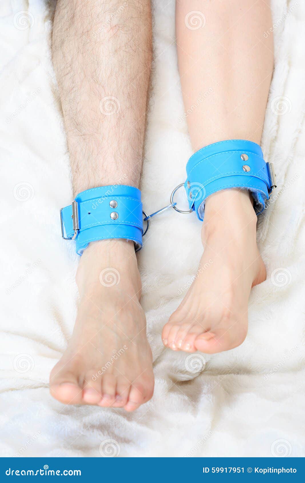 Male and Female Legs in Handcuffs photo