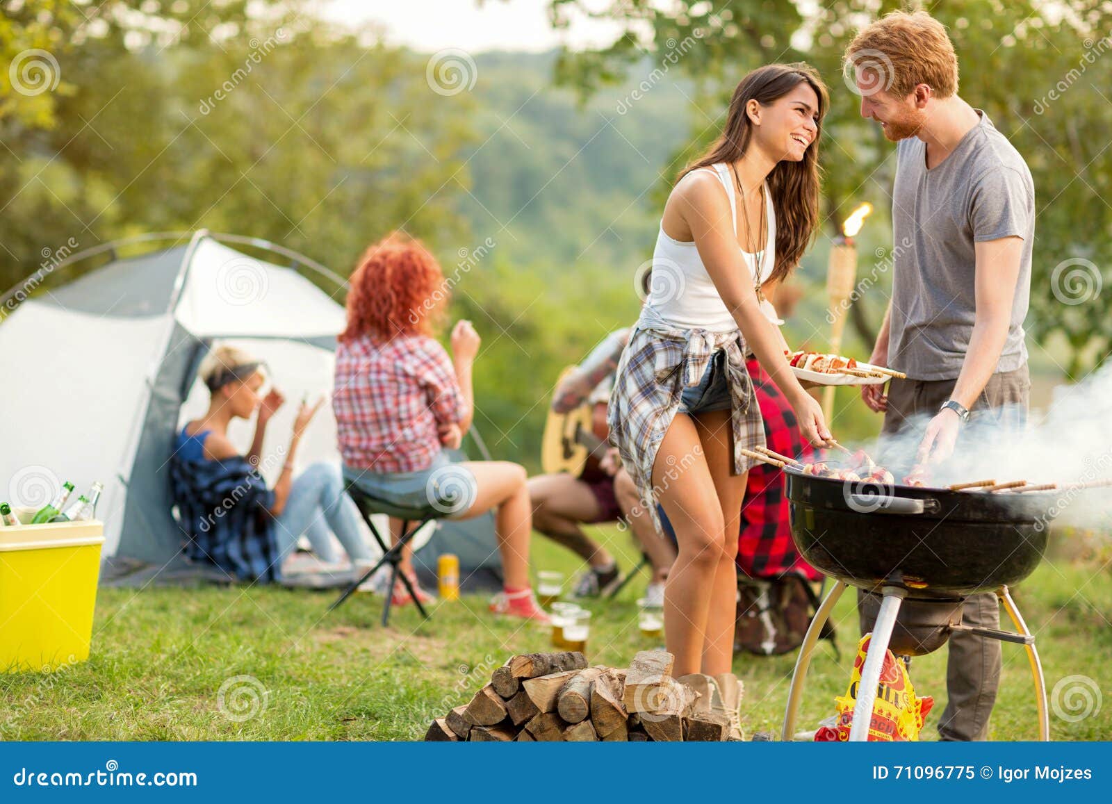 male and female lovingly look each other while baked barbecue