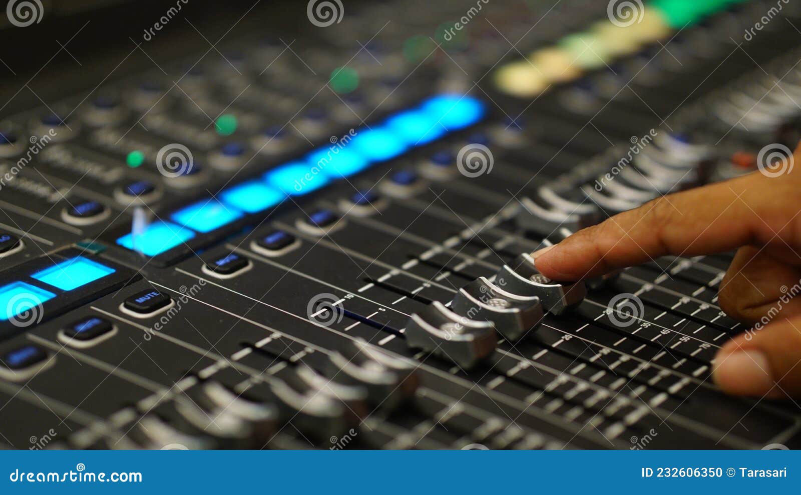 Male Finger on Audio Mixer Slider Button. Focus Selected on the