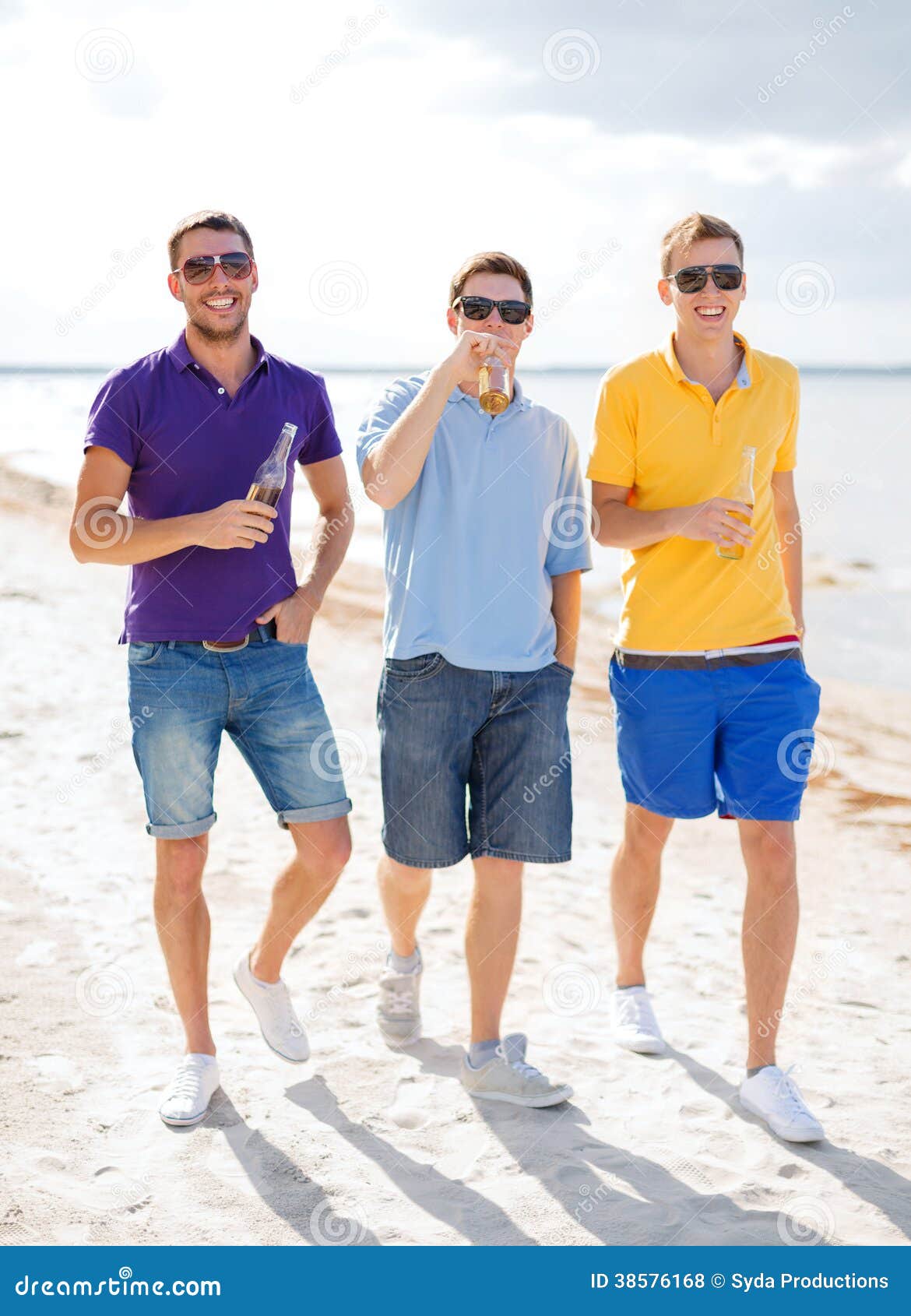 Male Friends on the Beach with Bottles of Drink Stock Photo - Image of ...