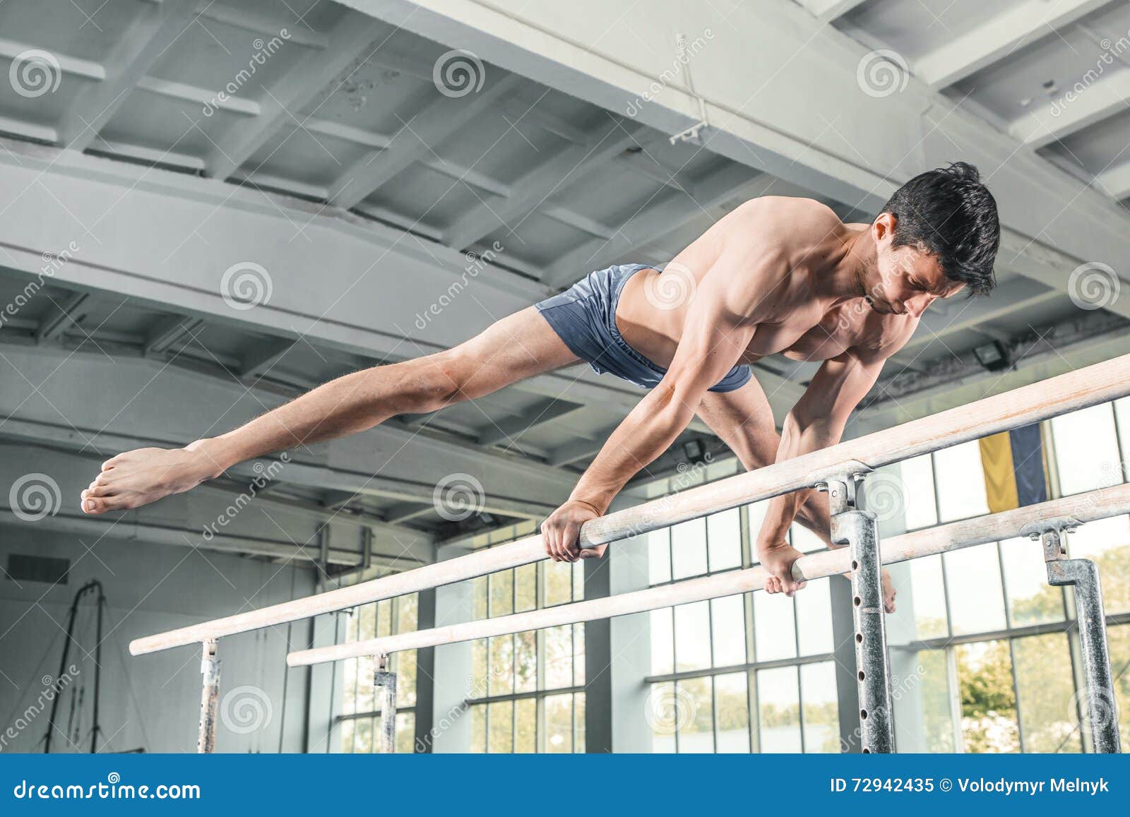 Male Gymnast Performing Handstand On Parallel Bars Stock Image Image Of Parallel Gripping