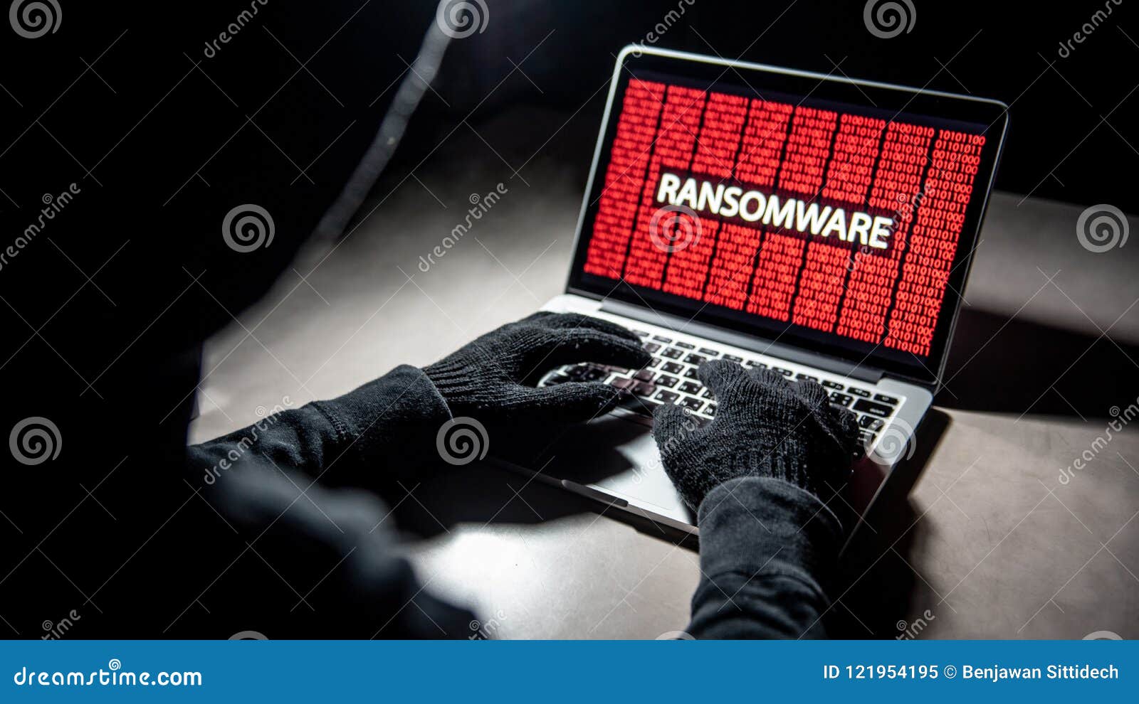 hacker hand on laptop with ransomware attack screen