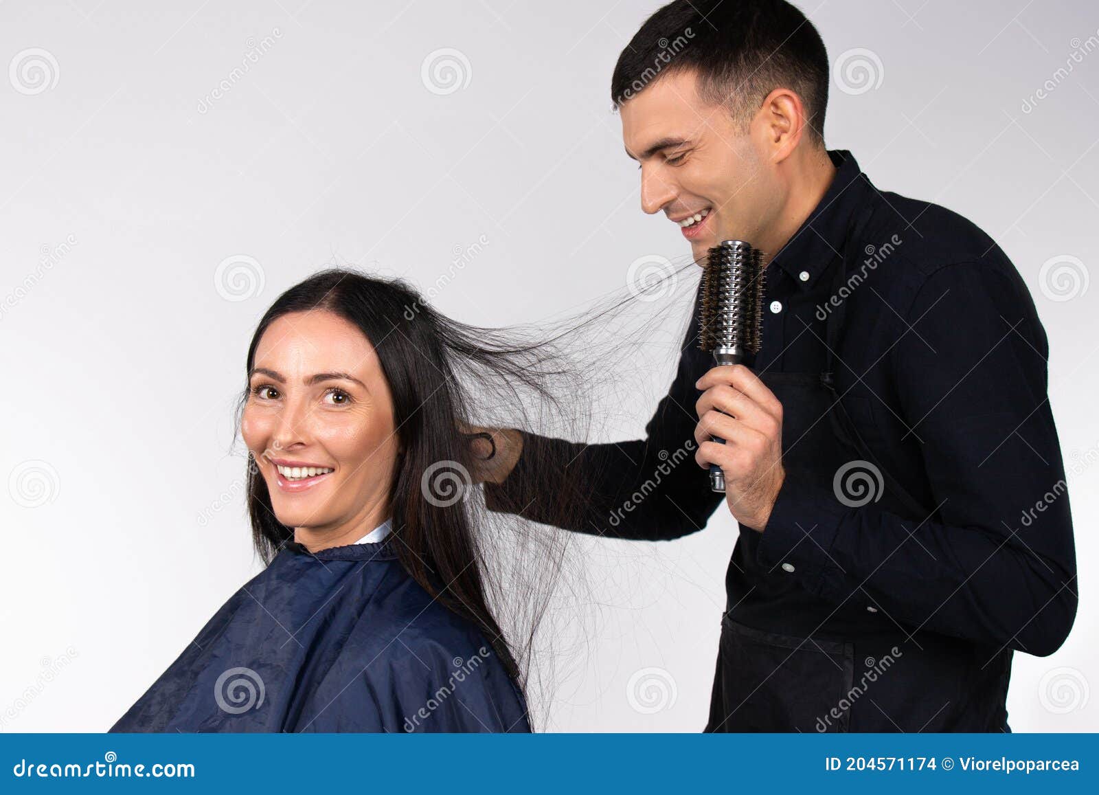 The Male Hairdresser is Styling Hair with a Round Brush To. Brunette Girl. White Background Stock Photo - Image of combat, gender: 204571174 The Male Hairdresser is Styling Hair with a Round Brush To. Brunette Girl. White Background Stock Photo - Image of combat, gender: 204571174