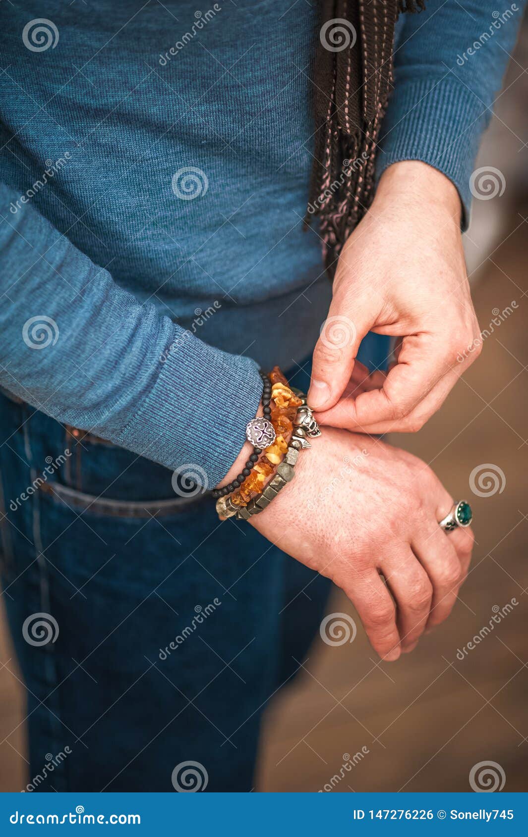Male Hand in a Bracelet with a Skull in the Pocket of Jeans Closeup and  Copy Space Stock Photo - Image of bracelets, fashion: 147276584