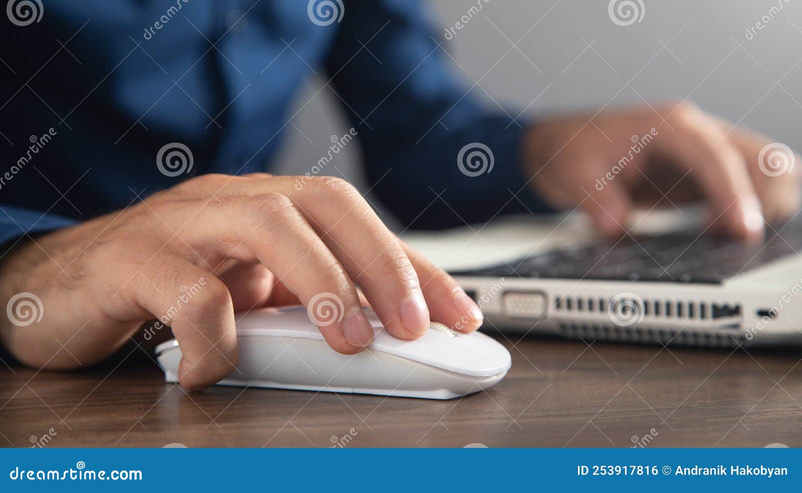 Male Hand Clicking Computer Mouse and Typing in Computer Keyboard