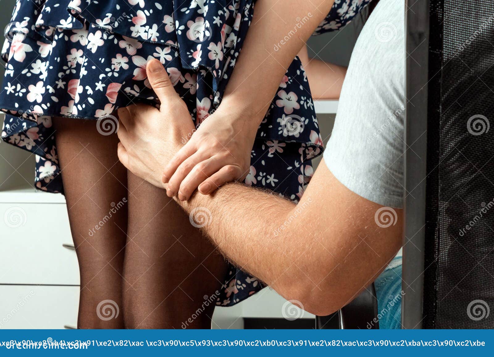 A Male Hand Climbs a Girl Under a Skirt ...