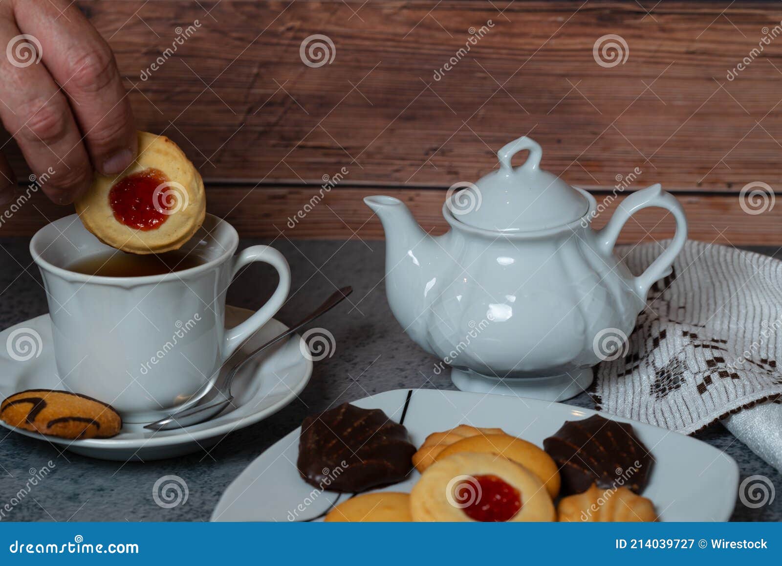 Male Hand Dipping a Cookie into a Cup of Hot Tea Stock Image Image of