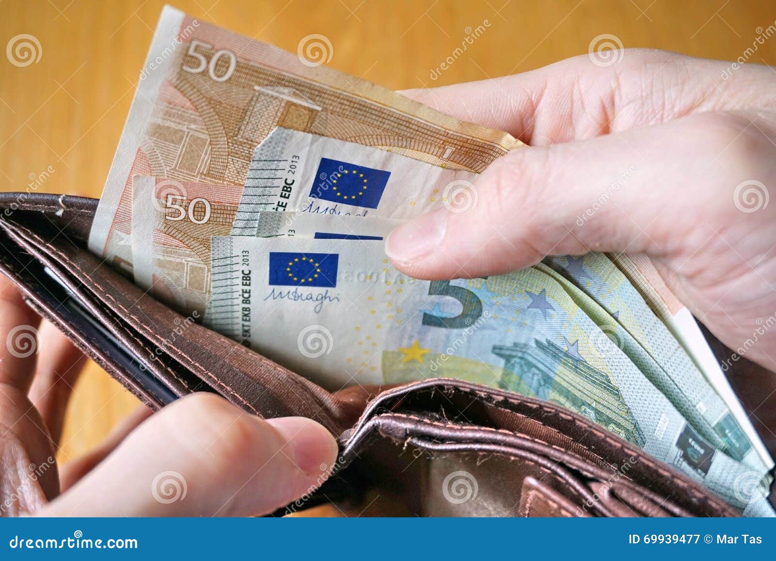 Male Hand Holding A Leather Wallet And Withdrawing European Currency (Euro, EUR) Stock Image ...