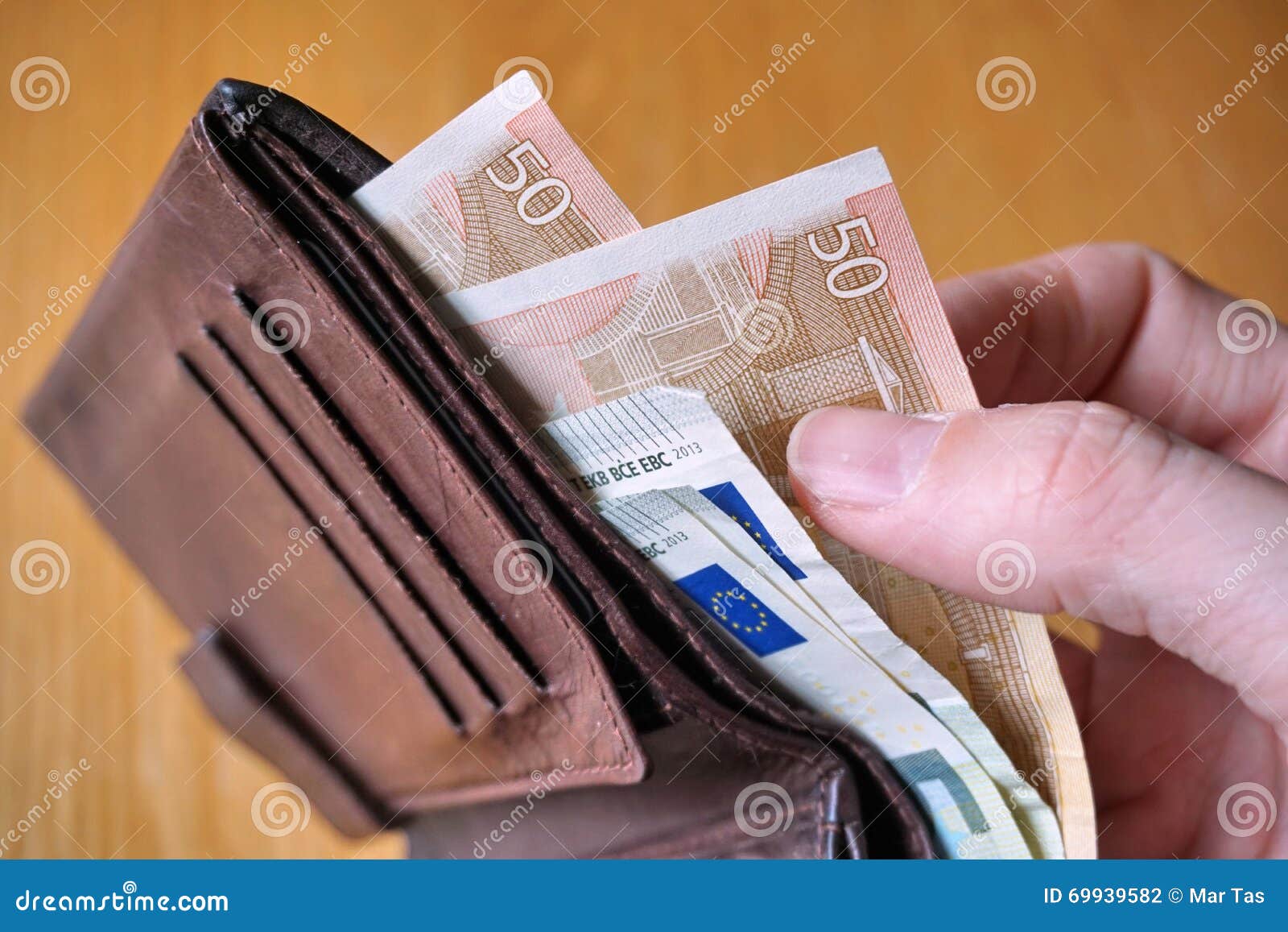 Male Hand Holding A Leather Wallet And Withdrawing European Currency (Euro, EUR) Stock Photo ...