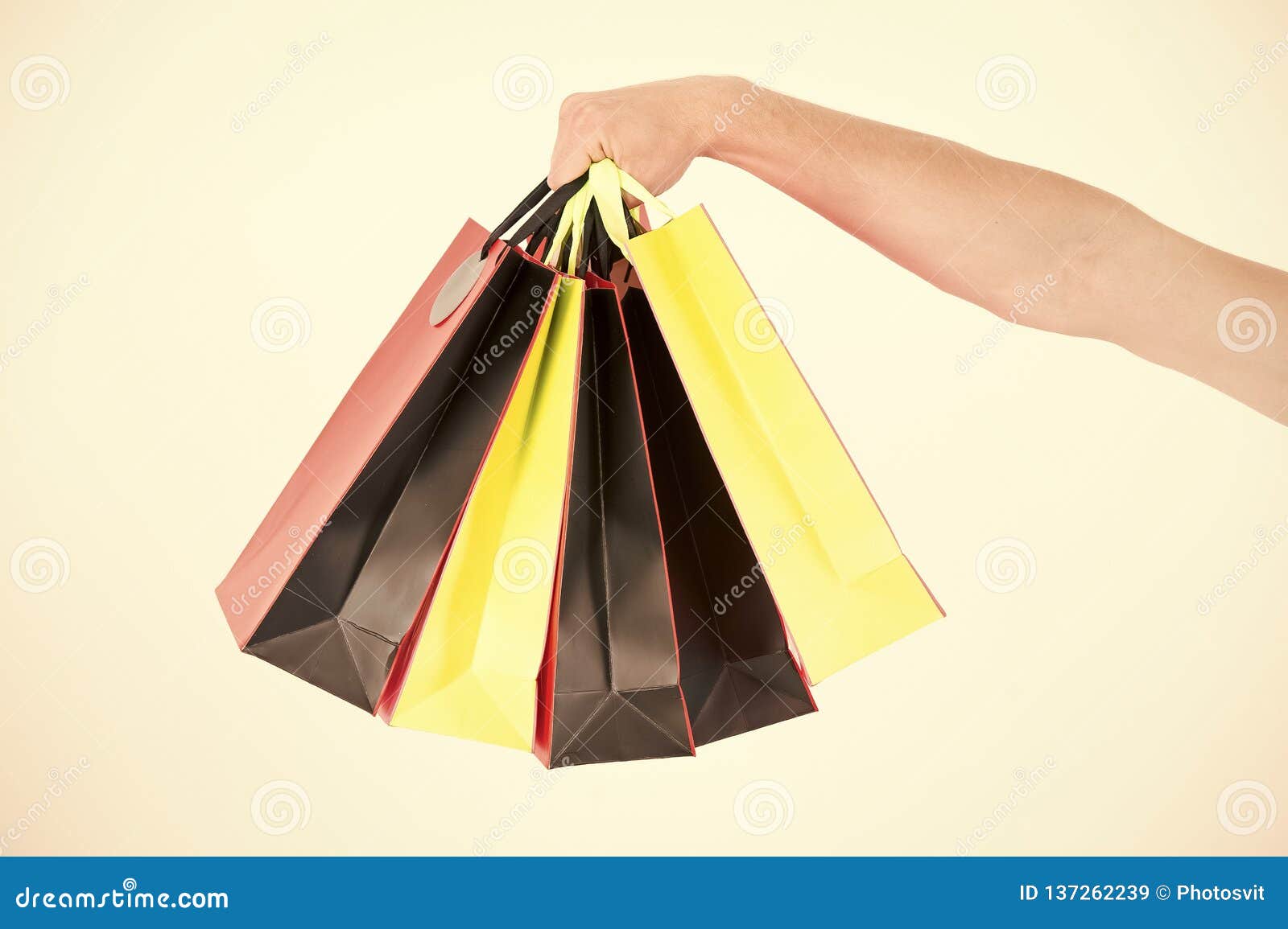 Male Hand Holds Five Shopping Bags. Shopping Concept. Hand Holds Bunch ...