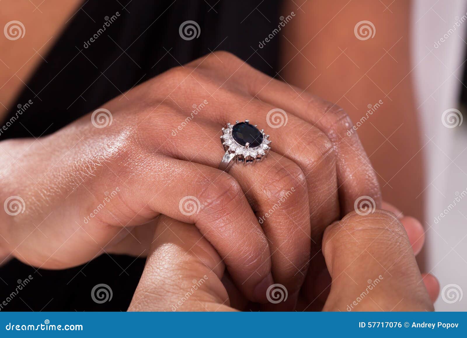 Male Hand Inserting Ring into a Finger Stock Photo - Image of engagement,  partner: 57717076