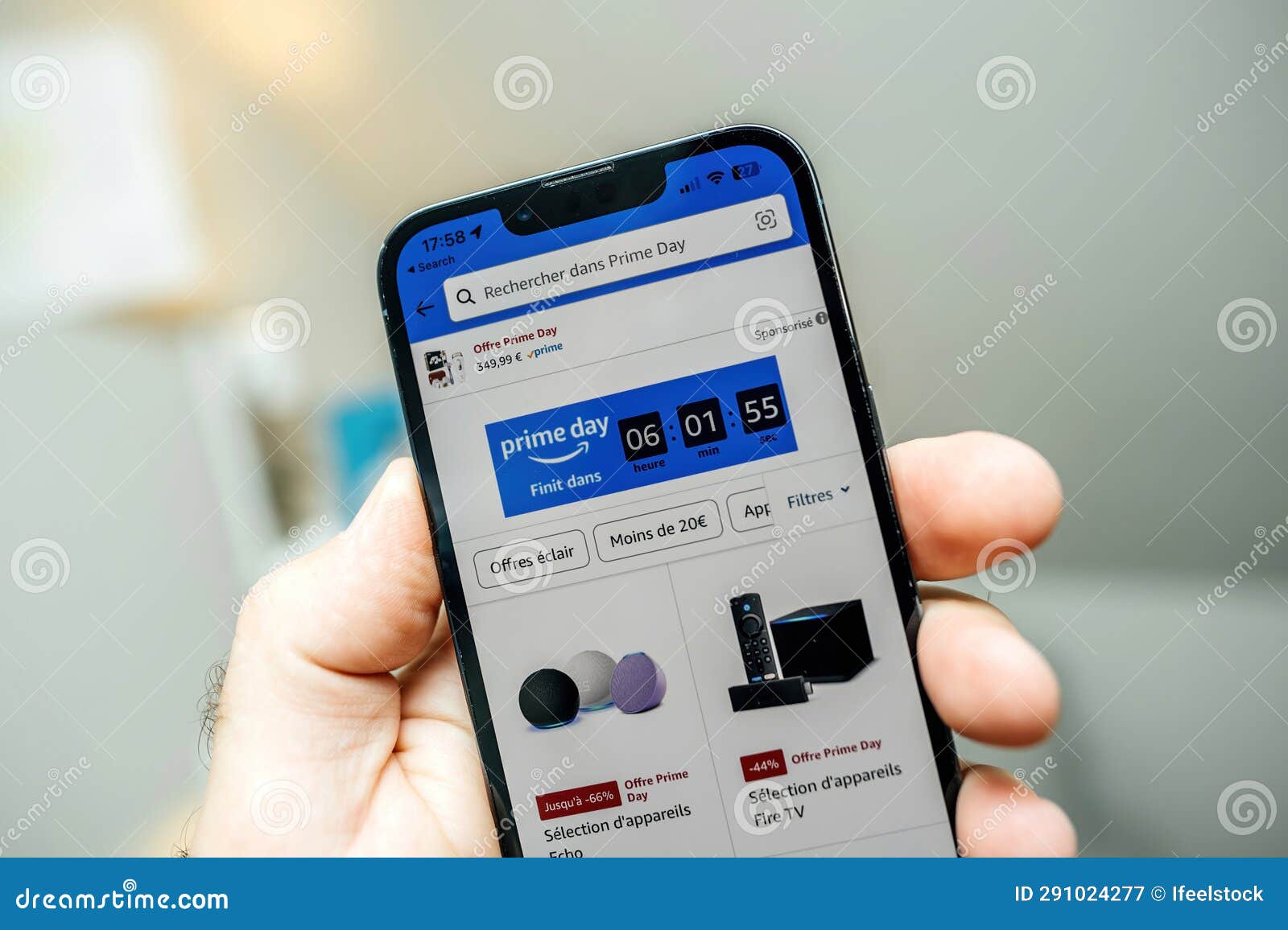 Male Hand with IPhone Showing Prime Day Countdown Editorial Photography