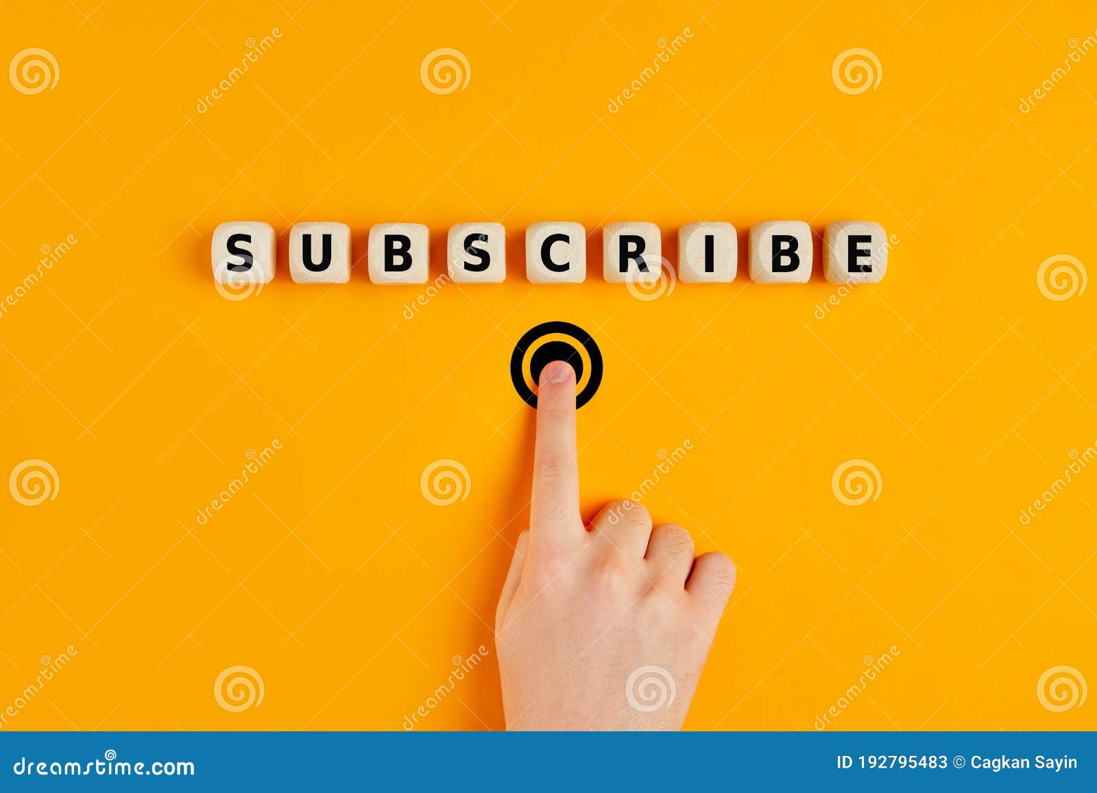 male hand pressing subscription button with the word subscribe written on wooden blocks. concept of online registration