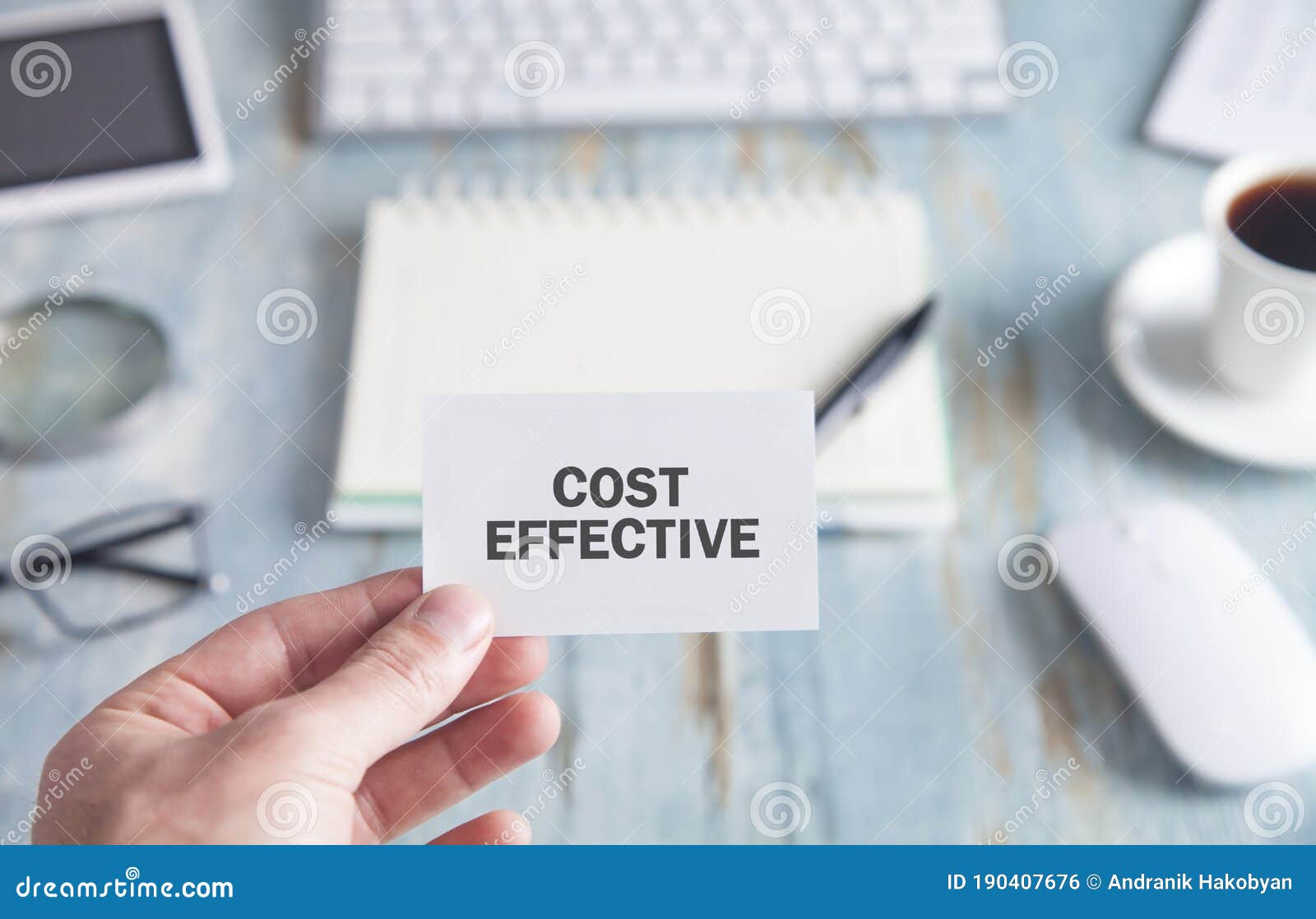 Male Hand Showing Cost Effective Text in Business Card Stock Photo Image of effective, finance