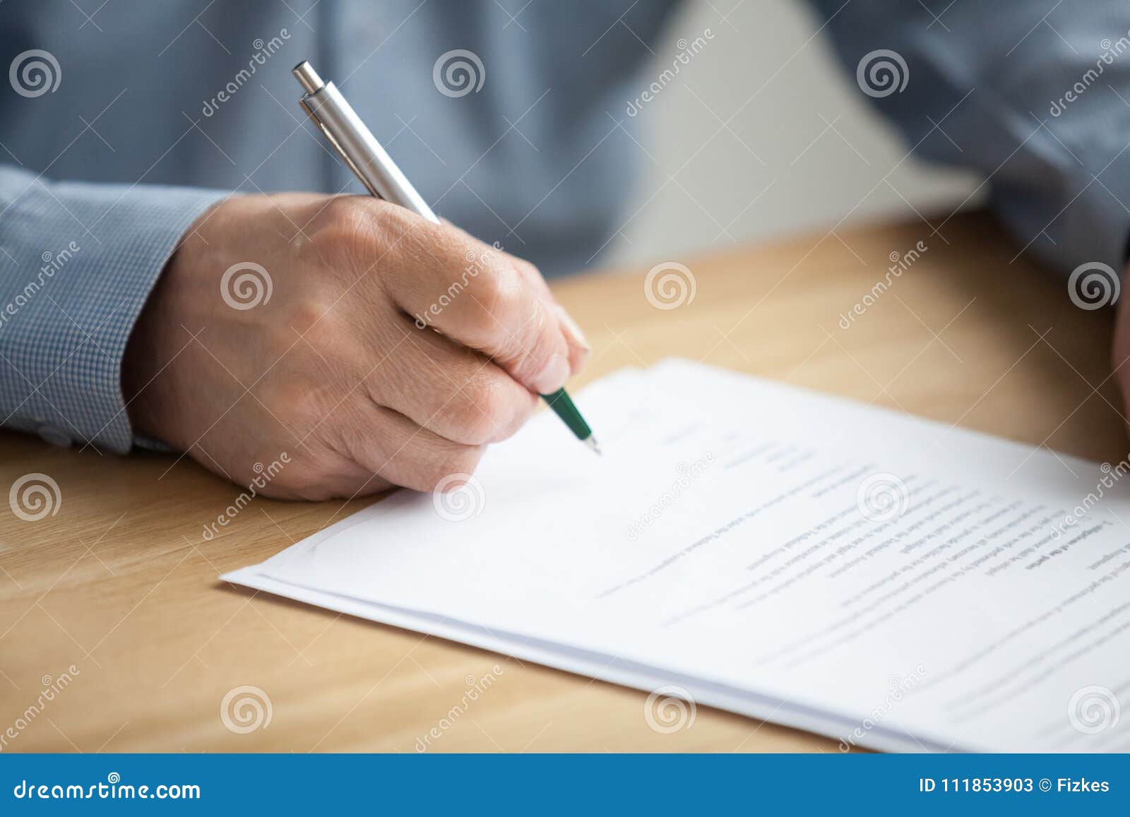 male hand signing document, senior man putting signature on pape