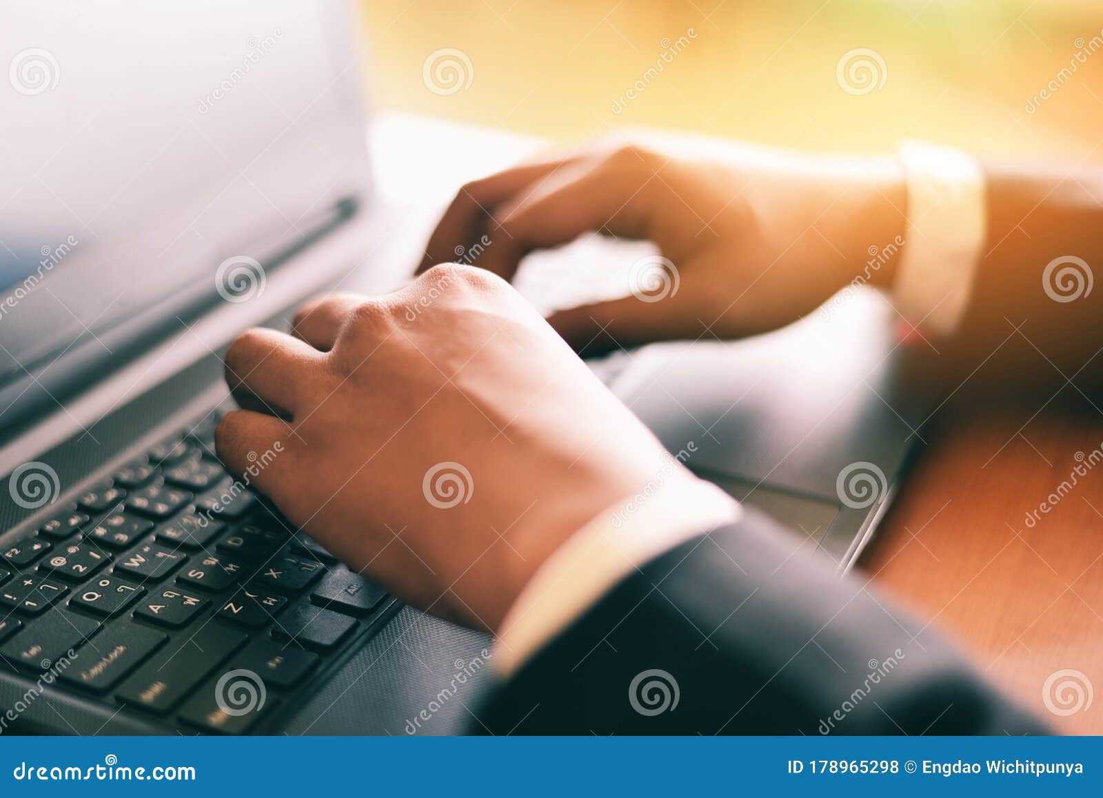 Adult Businessman Working At Sunny Office On Laptop While 