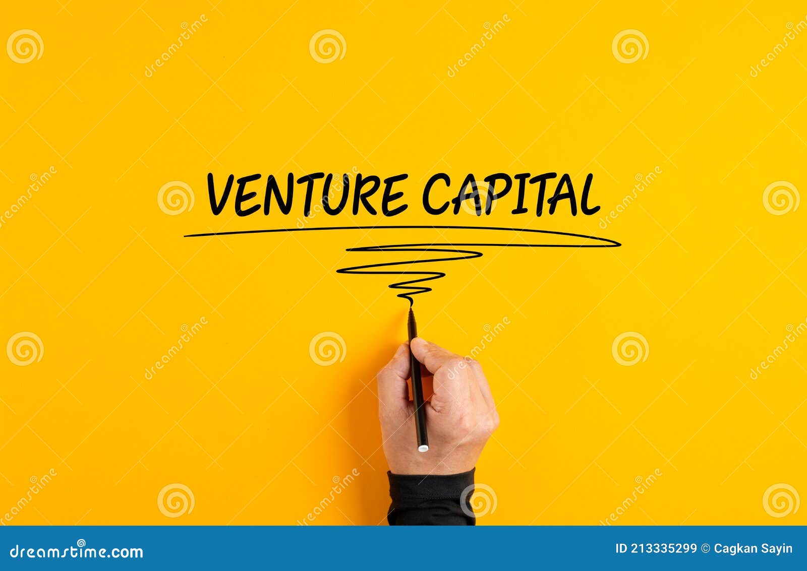 Male Hand Writing Venture Capital on Yellow Background Stock Image