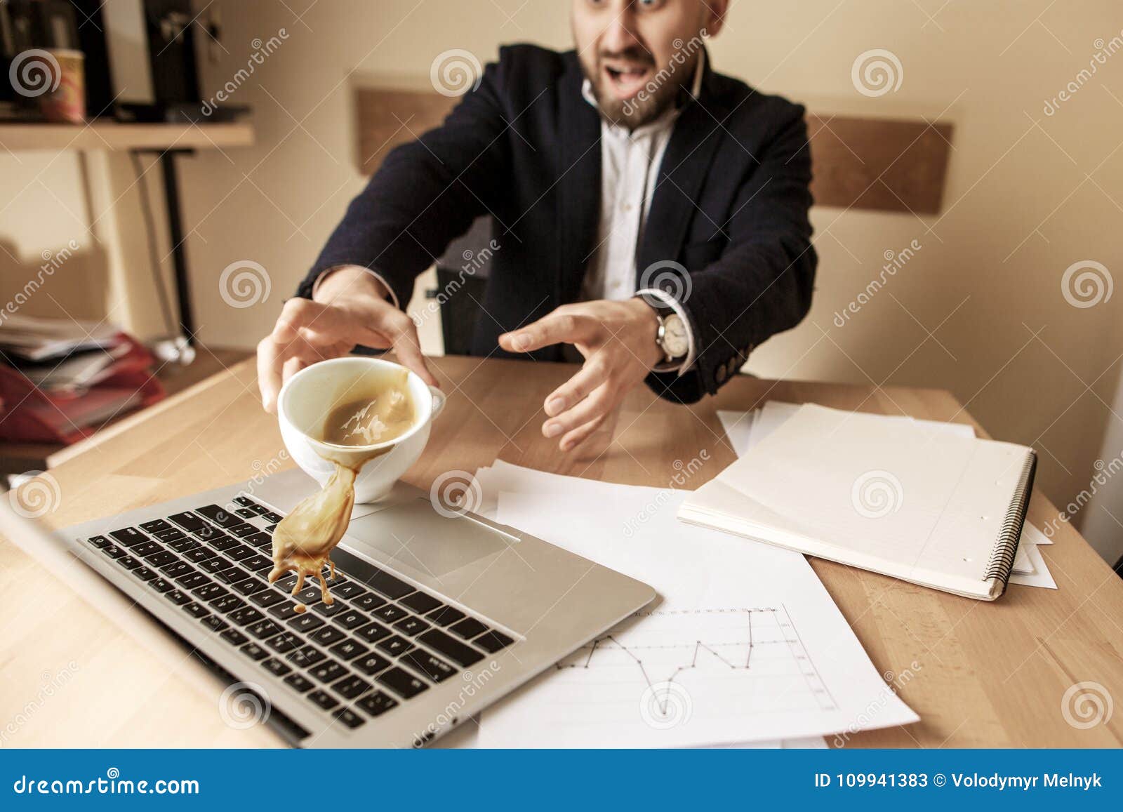 coffee in white cup spilling on the table in the morning working day at office table