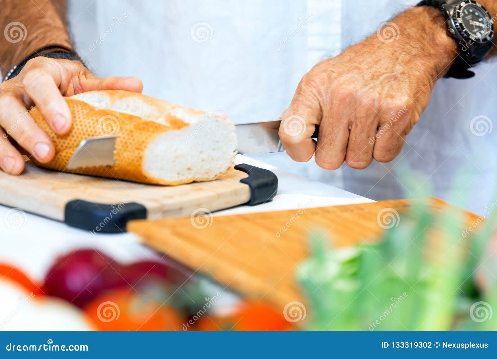 Male hands cutting bread stock photo. Image of chop 133319302