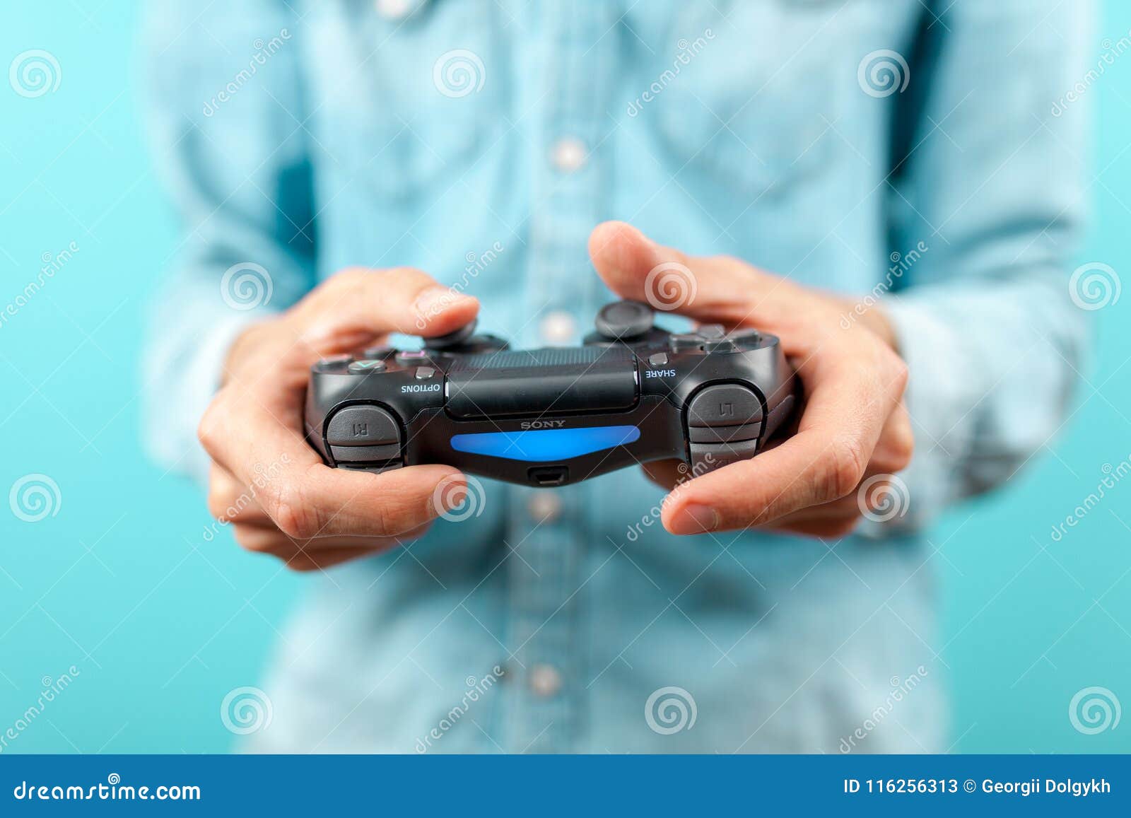 Male Hands Holding a PS4 Controller Editorial Stock Photo Image of