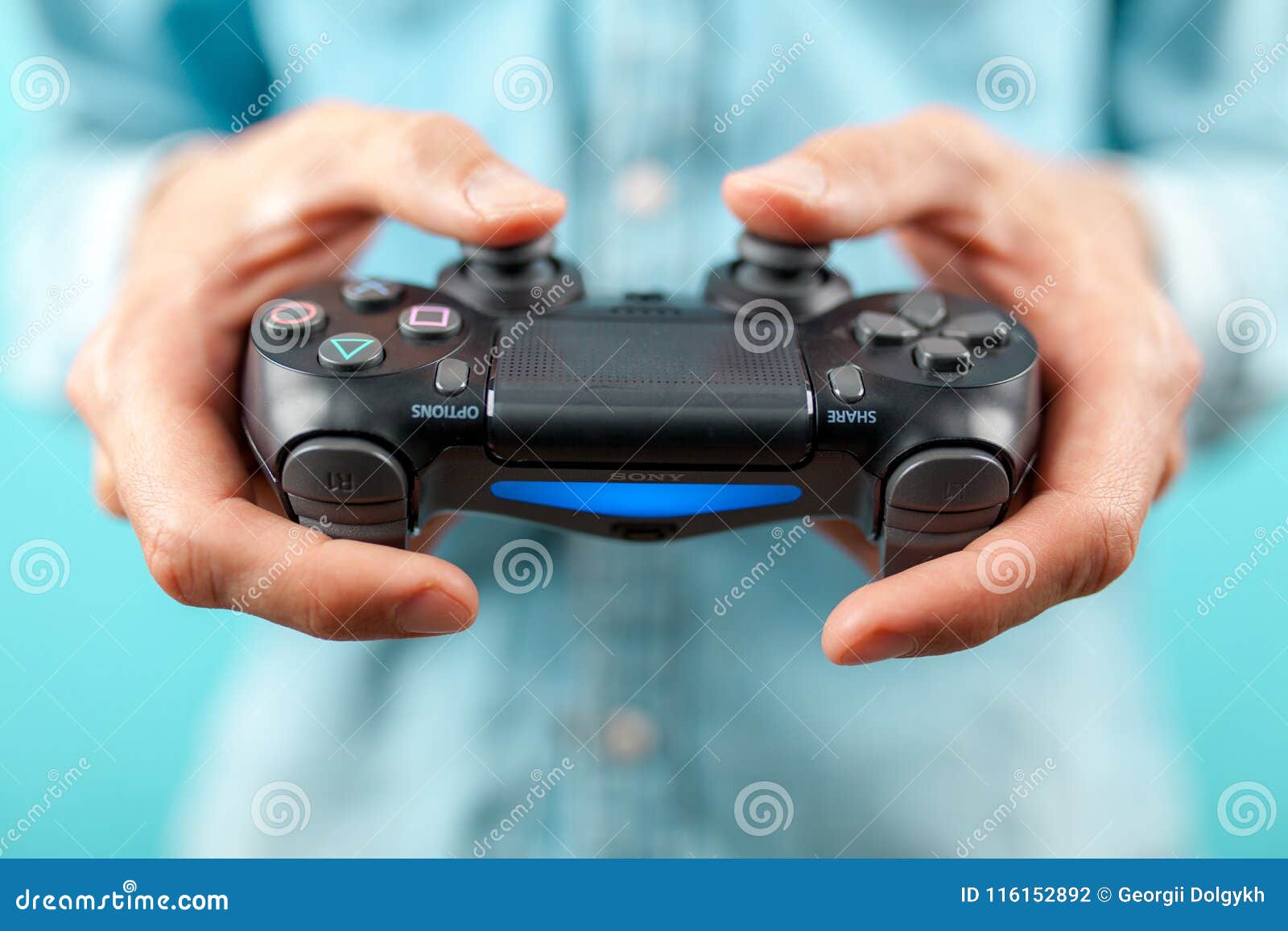 Male Hands Holding a PS4 Controller Editorial Photography - Image of  gamepad, accessory: 116152892