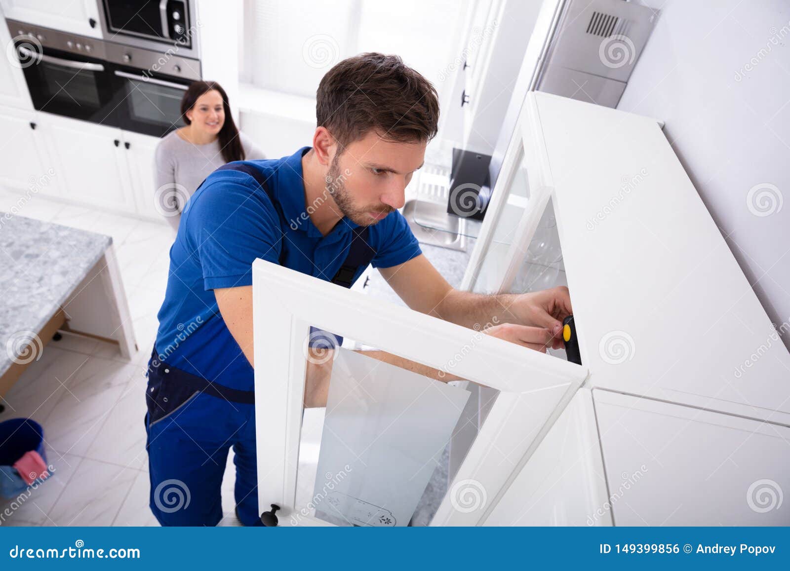 Male Handyman Installing Cabinet Door Stock Photo Image Of Full