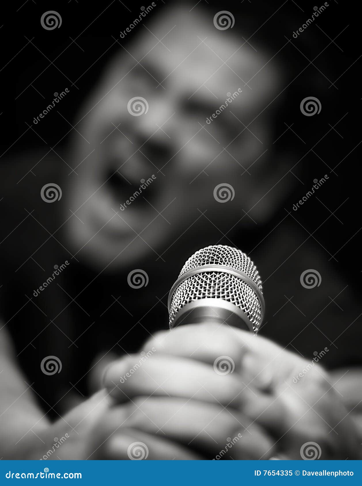 male heavy metal singer screams into microphone