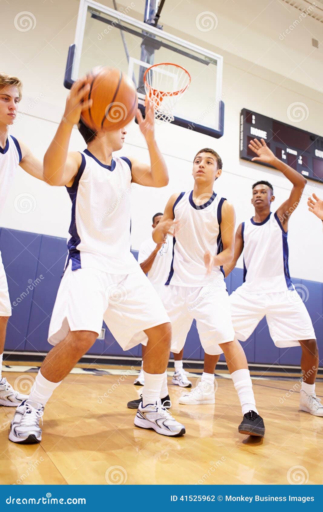 male high school basketball team playing game
