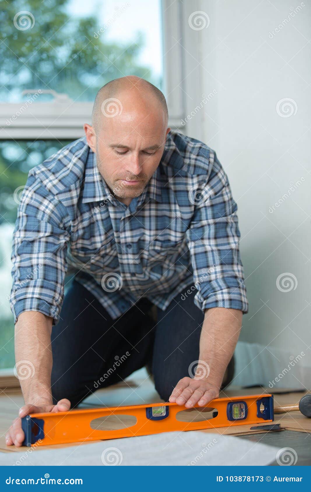 A Male Joiner Works With A Handheld Circular Saw. A Builder Is Sawing