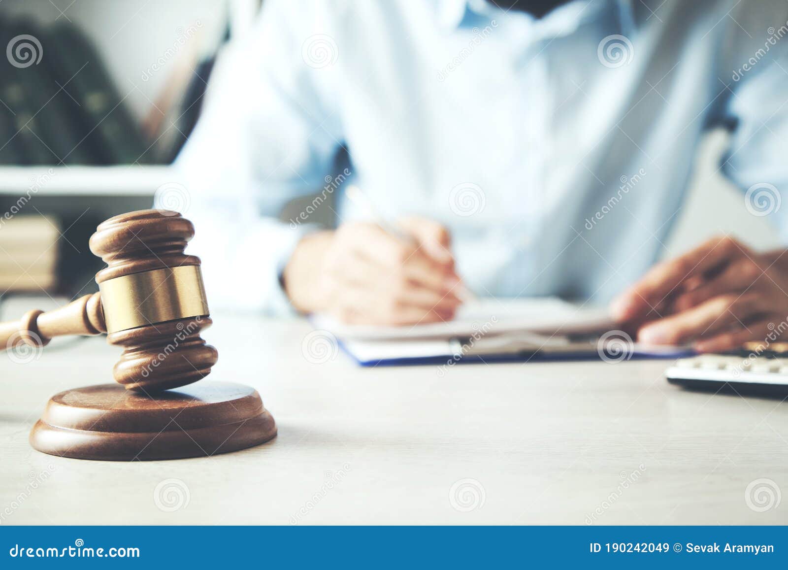 Male Judge Working with Document and Law Accessories on Table Stock