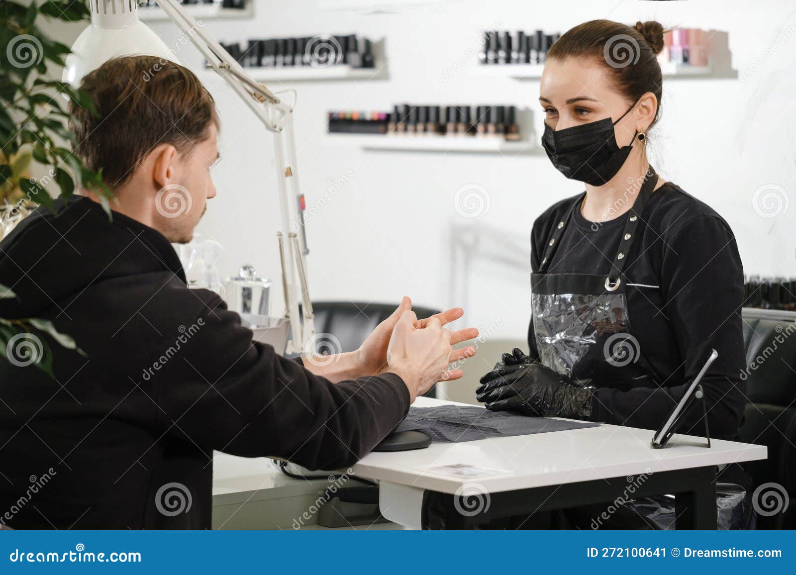 male manicure. close up view of the nail service master doing manicure for man