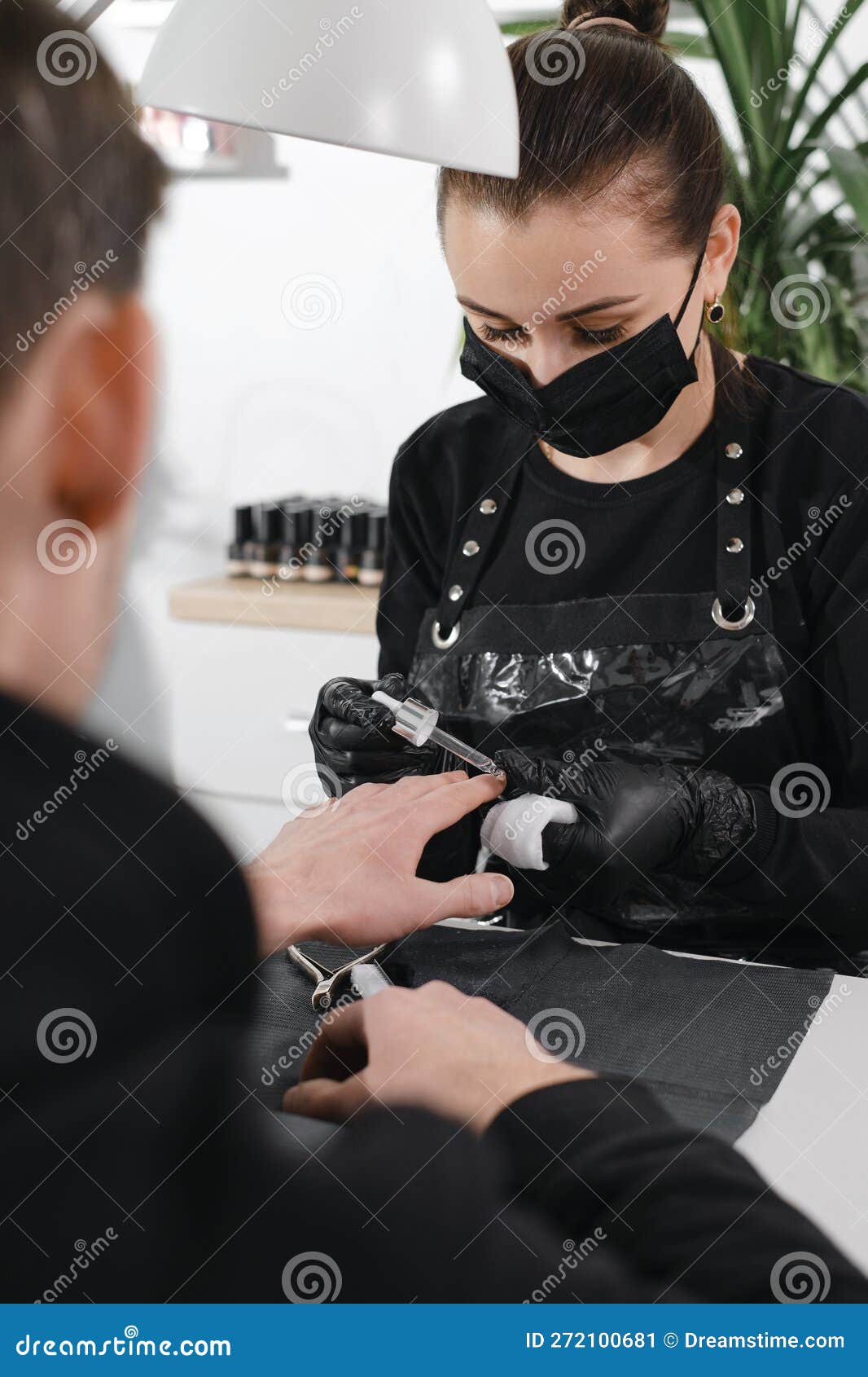 male manicure. close up view of the nail service master doing manicure for man