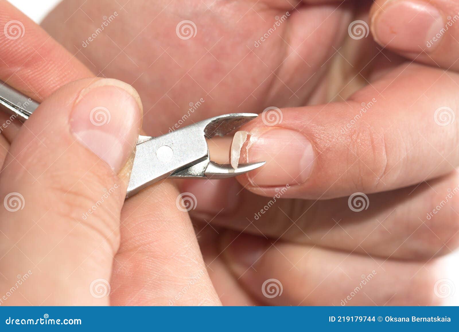Male Manicure. Woman Hands In Blue Sterile Gloves Holding Male Finger