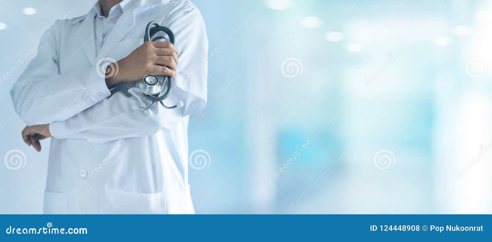 male medicine doctor with stethoscope standing confidently