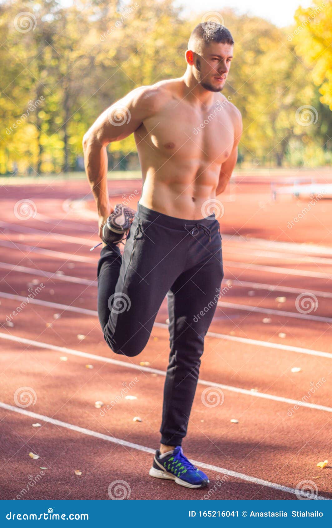 Male Model with Muscular Fit and Slim Body at the City Stadium
