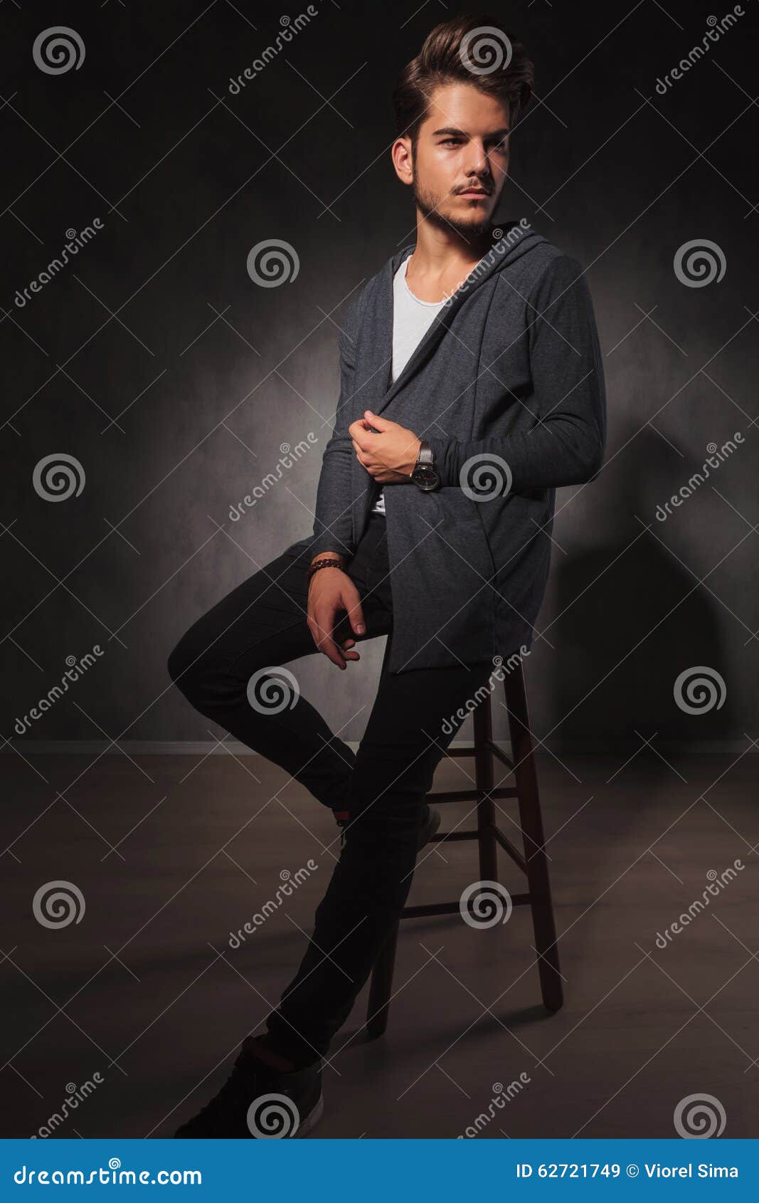 Male Model Posing in Studio while Arranging His Jacket Stock Image ...