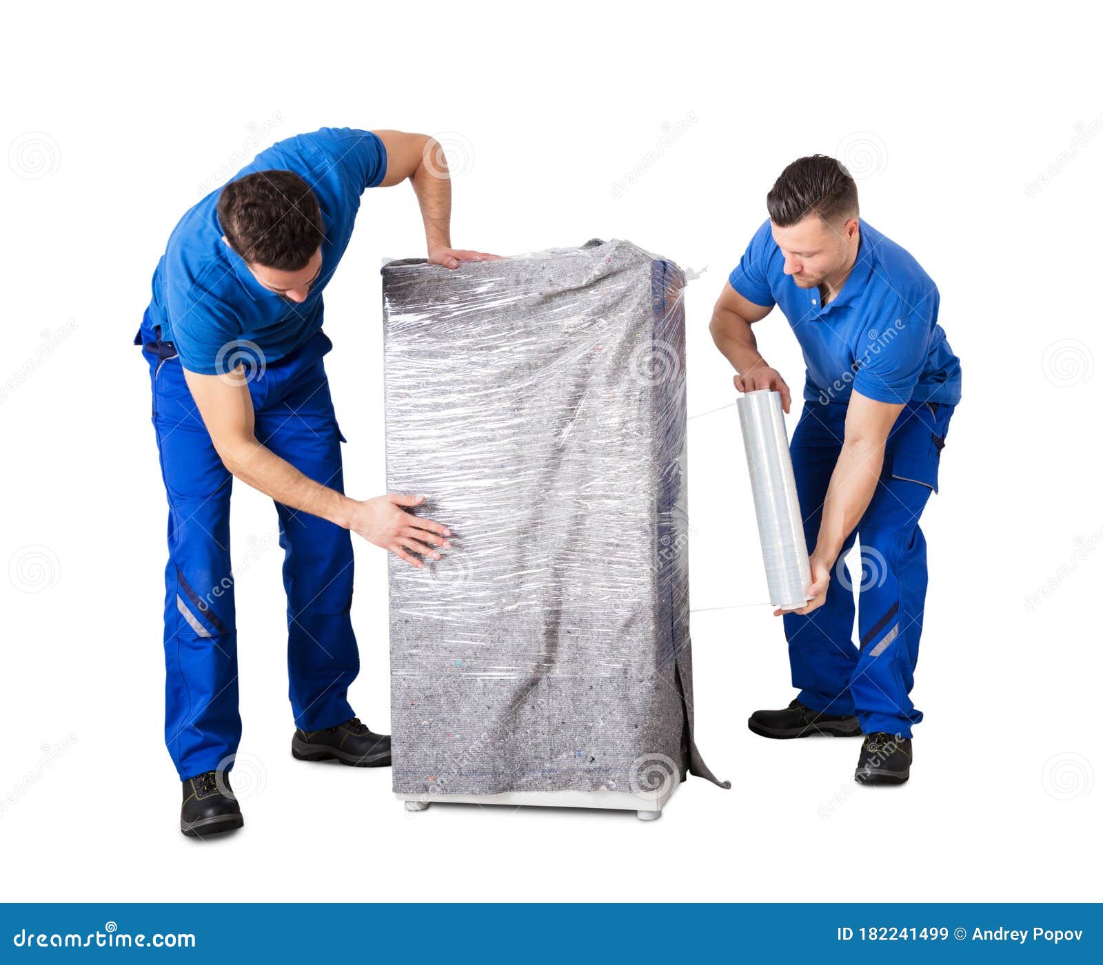 Male Movers Wrapping the Home Appliances with Plastic Wrap Stock Image
