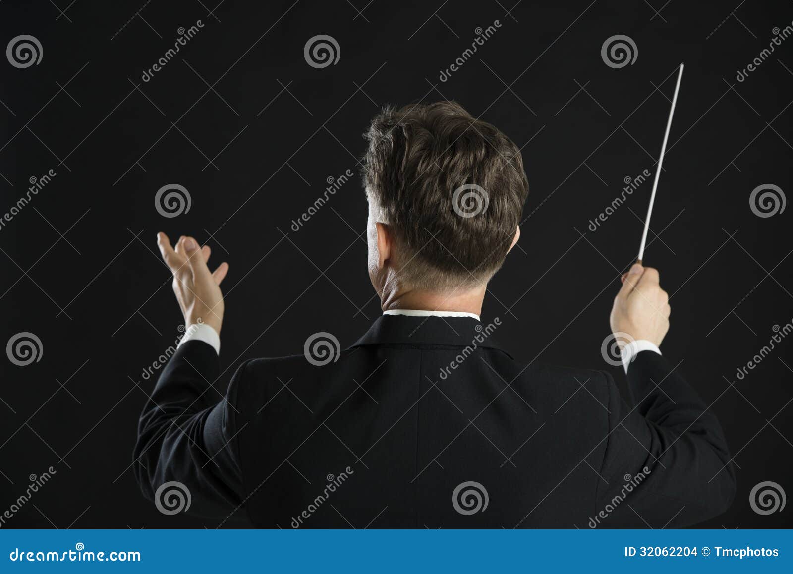 male music conductor directing with his baton