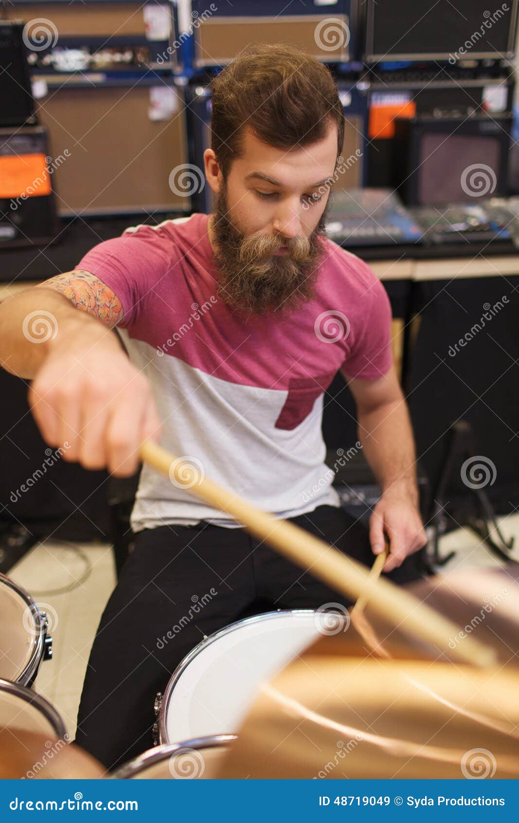 Male Musician Playing Cymbals at Music Store Stock Image - Image of ...