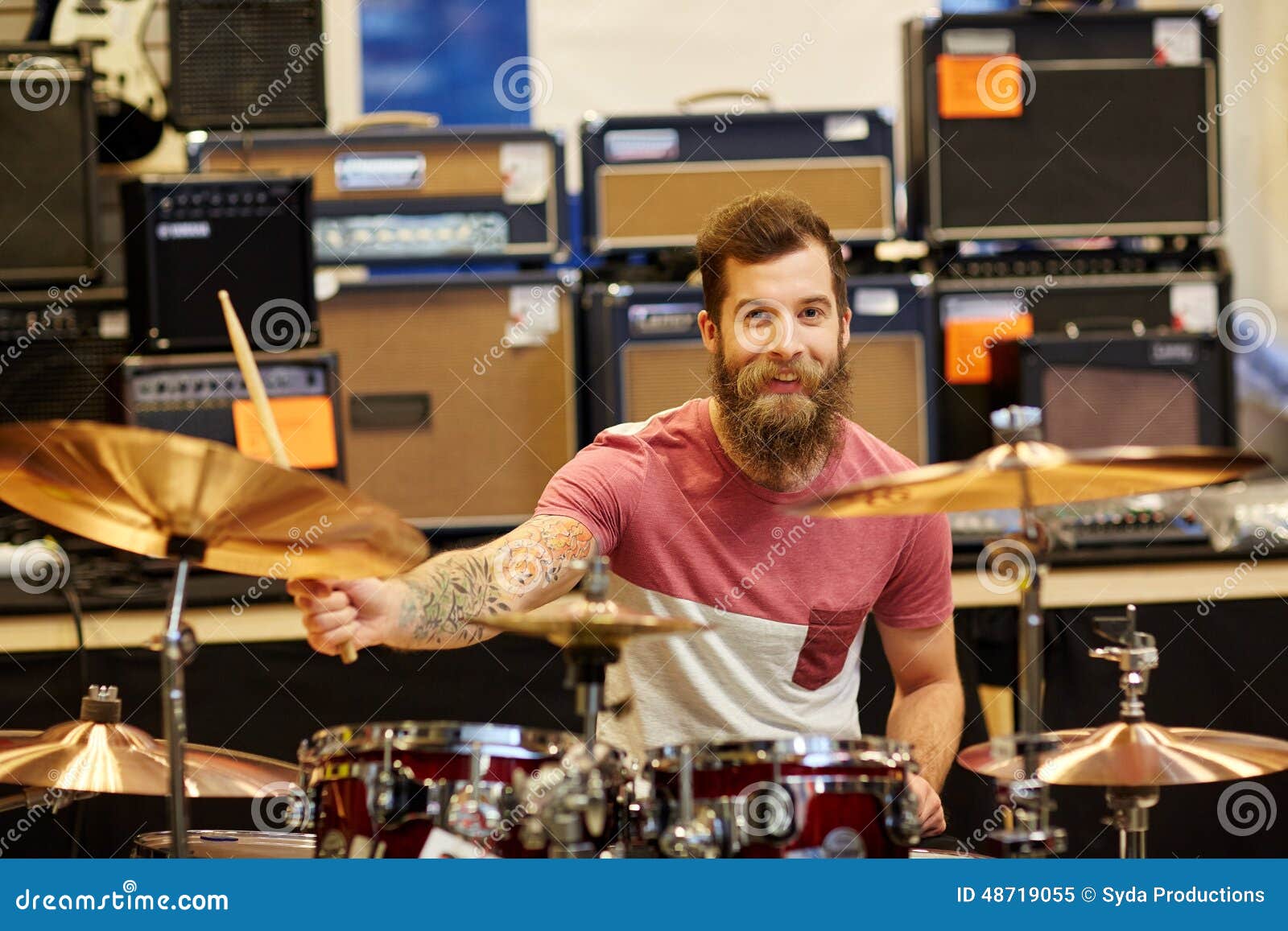 Male Musician Playing Cymbals at Music Store Stock Image - Image of ...