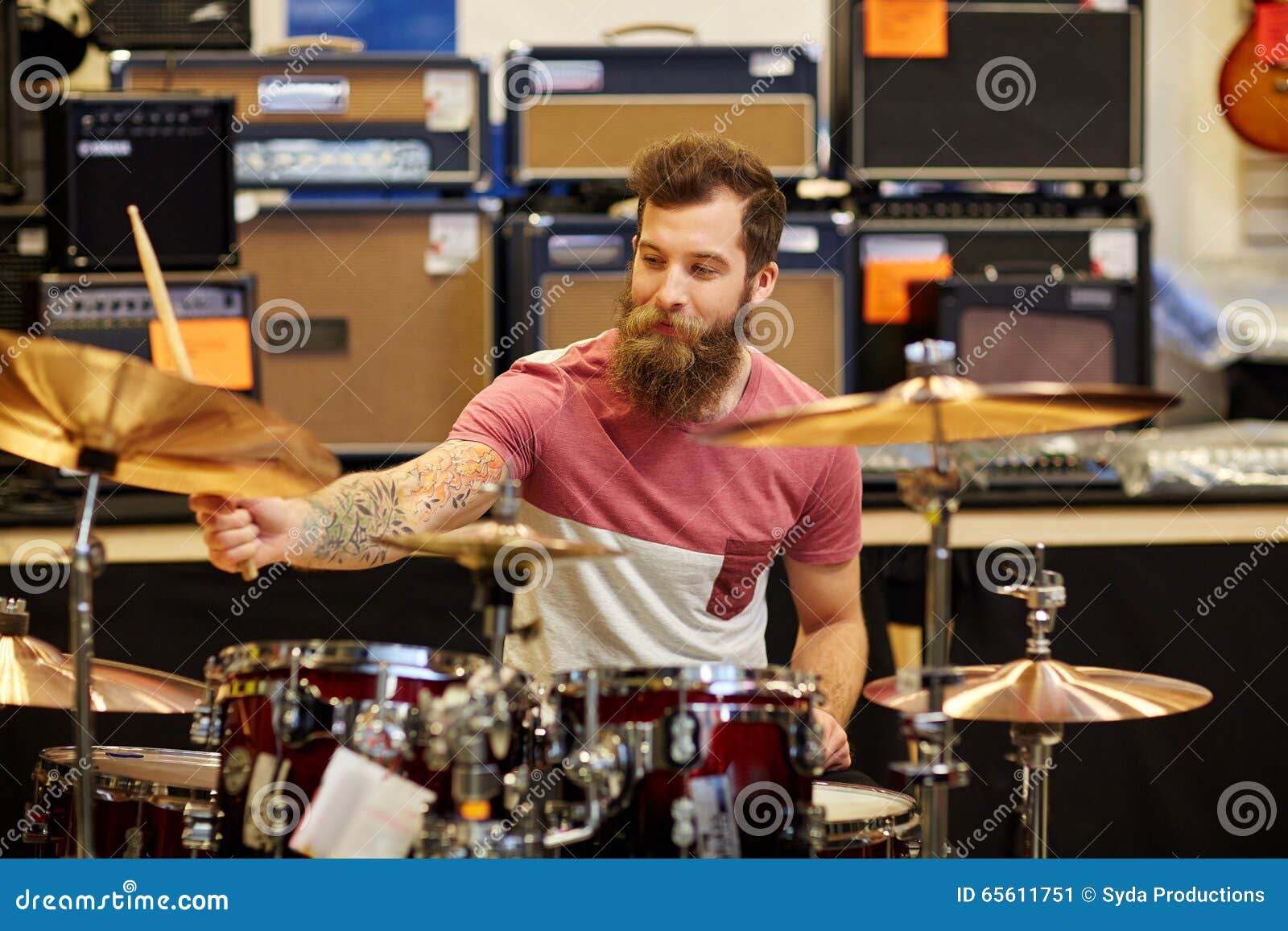 Male Musician Playing Cymbals at Music Store Stock Image - Image of ...