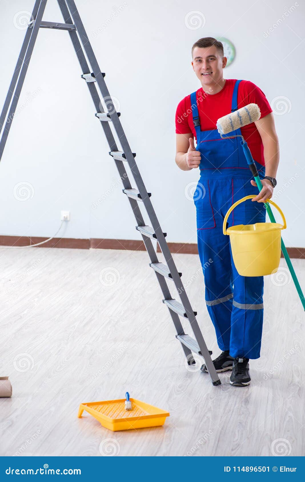 The Male Painter Preparing for Painting Job at Construction Site Stock